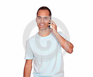 Smiling latin adult man speaking on cellphone