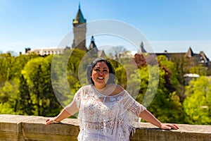 Smiling Latin American woman posing at viewpoint