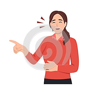 Smiling laughing and positive emotions concept. Young girl standing pointing at something and laughing with open mouth and words