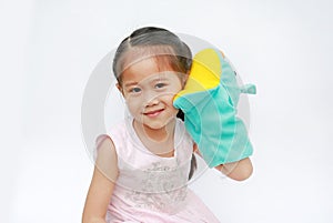 Smiling little Asian child girl hand wear and playing Rhinoceros puppets on white background. Educations concept photo