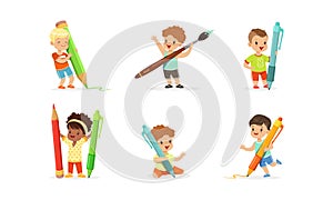 Smiling Little Boy and Girl with Big Pen, Pencil and Paintbrush Vector Set