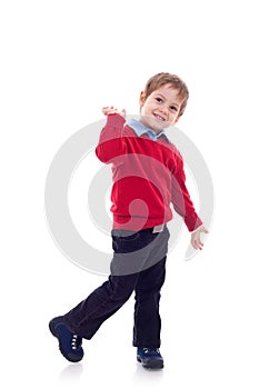 Smiling little boy in jeans