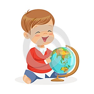 Smiling little boy sitting and playing with globe. Child learning the world colorful cartoon character vector