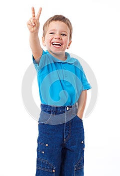 Smiling little boyl with victory sign