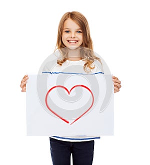 Smiling little child holding picture of heart