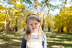 Smiling little girl in autumn