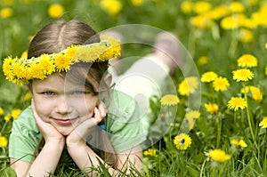 Smiling little girl in Dandelions
