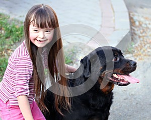 Smiling little girl with dog