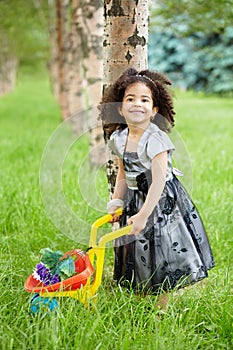 Smiling little girl dressed in beautiful black
