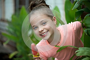 Smiling little girl with fruit ice cream