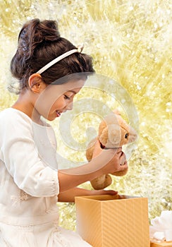 Smiling little girl with gift box