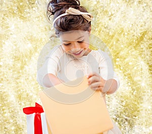 Smiling little girl with gift box