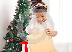 Smiling little girl with gift box