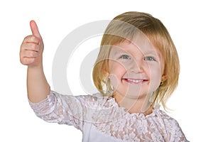 Smiling little girl with her thumb up