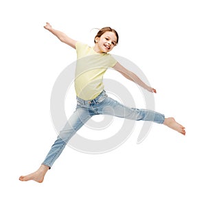 Smiling little girl jumping