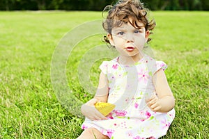 Smiling little girl on the meadow