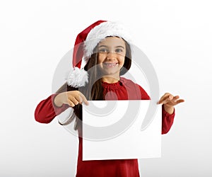 Smiling little girl in a Santa Hat with a sign
