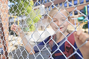 A smiling little girl at school playground