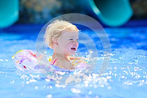 Smiling little girl in swimming pool