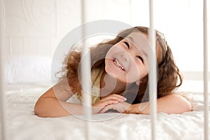 Smiling little girl waking up