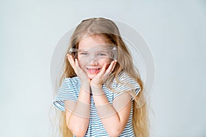 Smiling little girl wears safety goggles.
