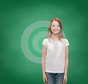 Smiling little girl in white blank t-shirt