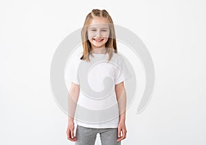 Smiling little girl in white t-shirt