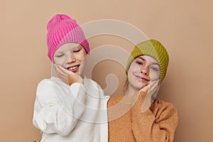 smiling little girls in hats studio childhood