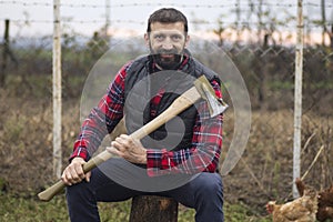 Smiling lumberjack with axe