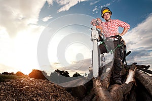 Smiling lumberjack with chainsaw