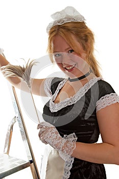 Smiling maid with a feather duster