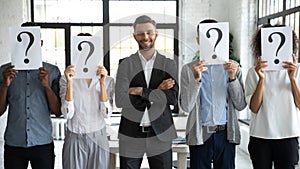 Smiling male applicant in line with unknown work candidates