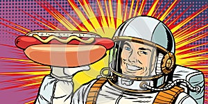Smiling male astronaut presents hot dog sausage
