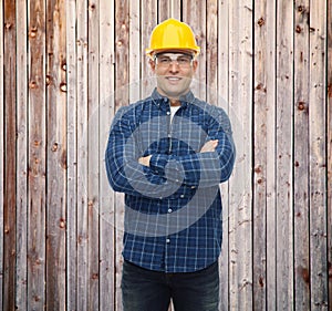 Smiling male builder or manual worker in helmet