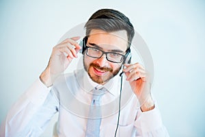 Smiling male call center operator