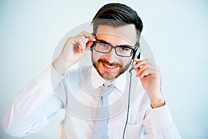 Smiling male call center operator