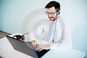 Smiling male call center operator