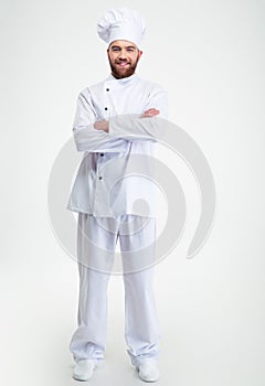 Smiling male chef cook standing with arms folded