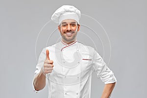 smiling male chef in toque showing thumbs up