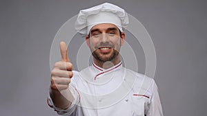 smiling male chef in toque showing thumbs up