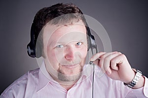 Smiling male customer service operator in headset