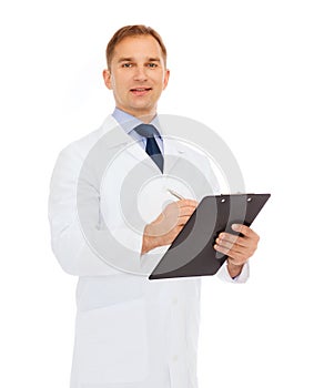 Smiling male doctor with clipboard