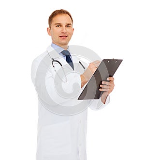 Smiling male doctor with clipboard and stethoscope