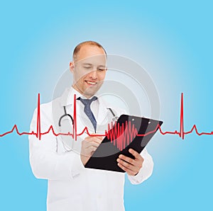 Smiling male doctor with clipboard and stethoscope