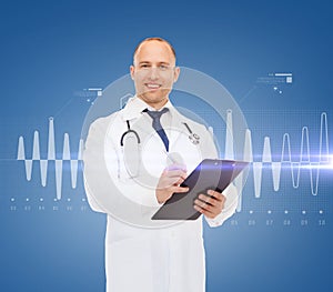 Smiling male doctor with clipboard and stethoscope