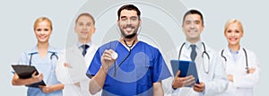 smiling male doctor or nurse with stethoscope