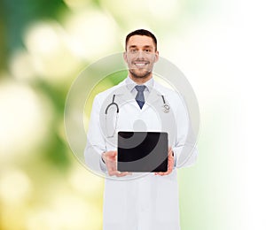 Smiling male doctor with tablet pc