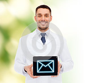 Smiling male doctor with tablet pc