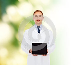 Smiling male doctor with tablet pc