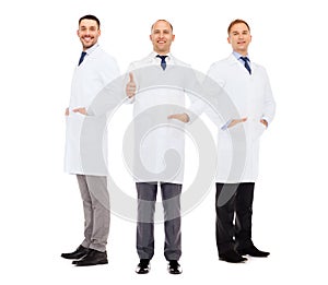 Smiling male doctors in white coats